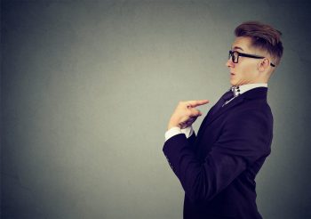Man pointing fingers at himself denies responsibility and accusations